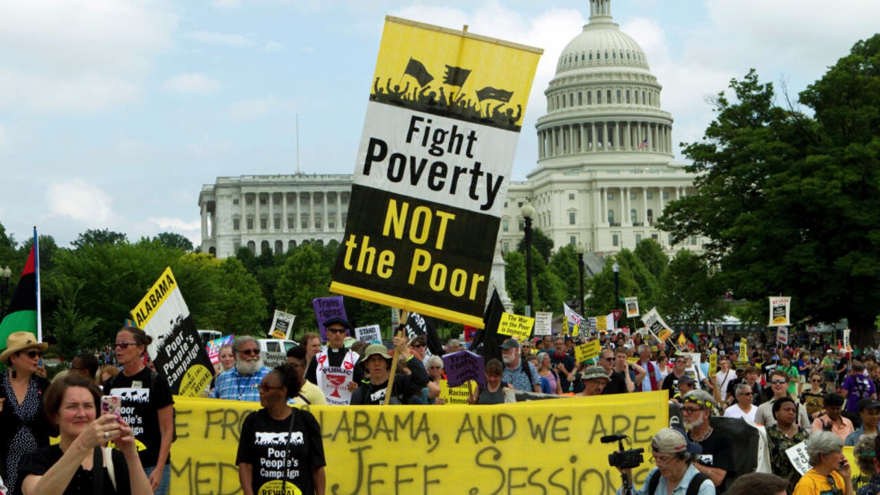 Demonstrators march outside the U.S. Capitol during the Poor People's Campaign rally at the National Mall in Washington on Saturday, June 23, 2018. (AP Photo/Jose Luis Magana)