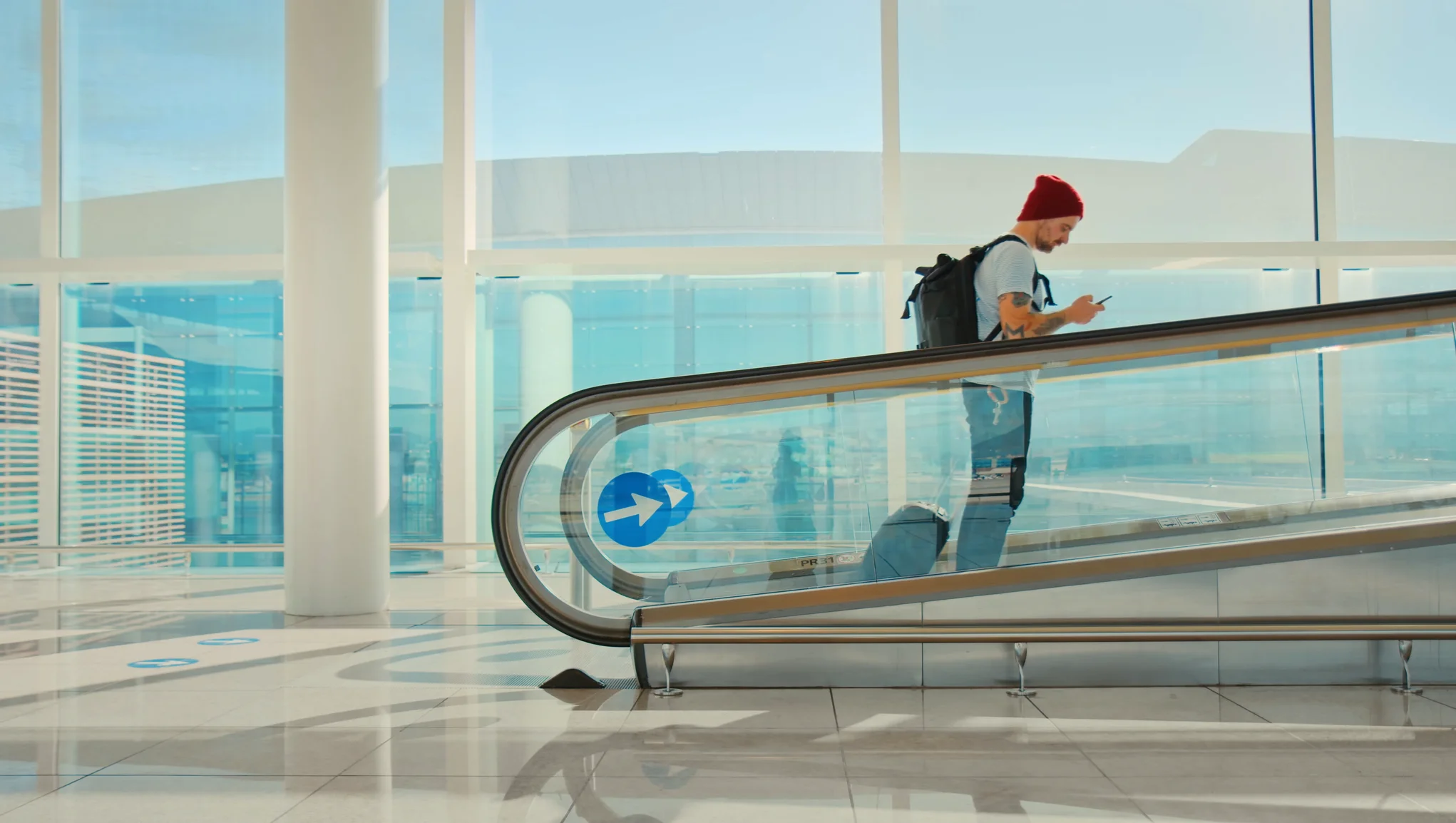 man on travel on an escalator