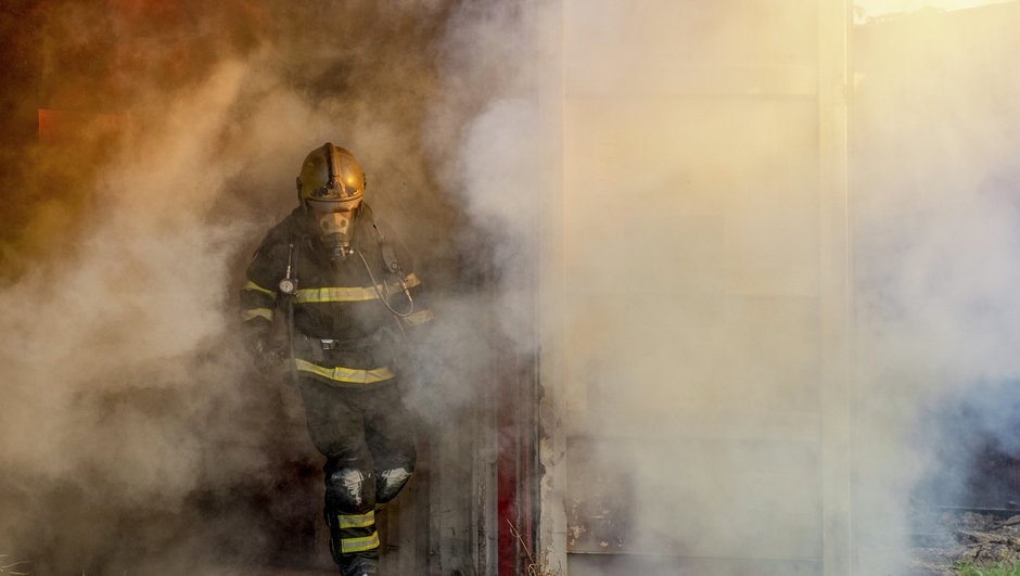 fire fighter putting out a fire.