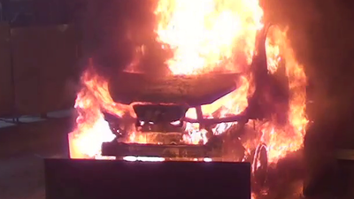 electric vehicle in flames.