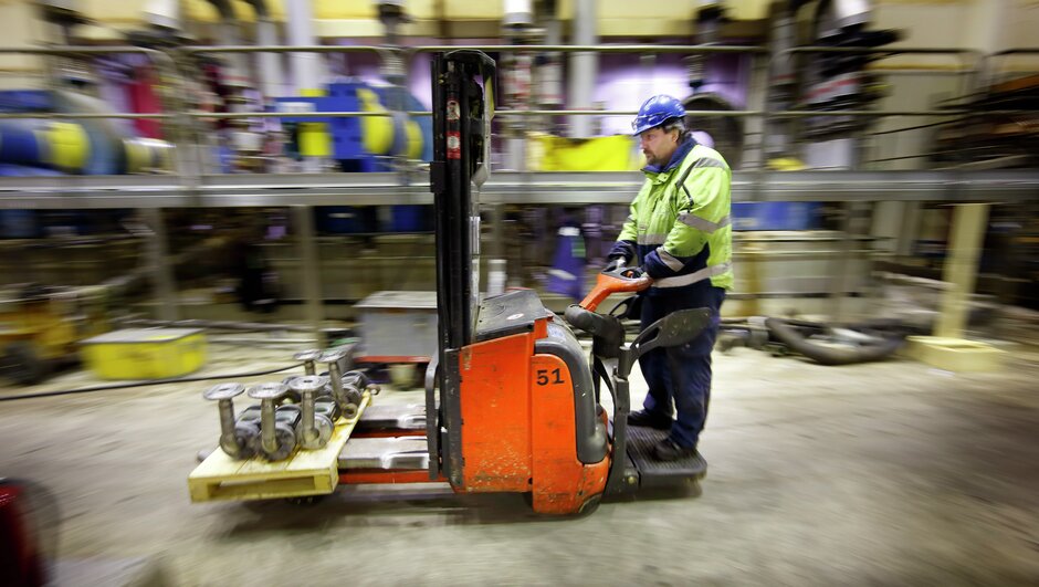 man driving a forklift.